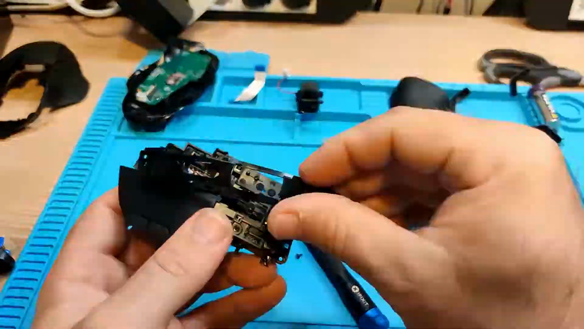 Logitech G604 mouse being reassembled after switch replacement